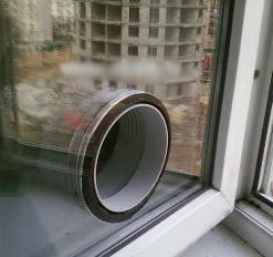 The hole in the pane to the mobile air conditioner