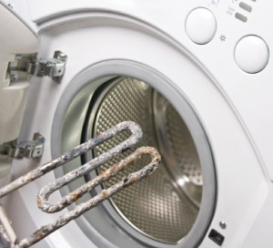 Washing machine and damaged electric heater